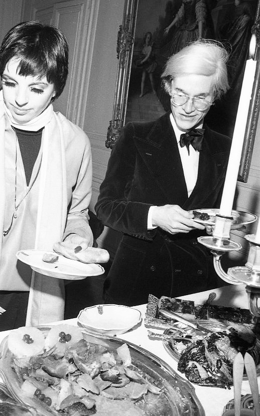 1581791542514-5-Liza-Minnelli-and-Andy-Warhol-at-Versailles-THE-TIMES-OF-BILL-CUNNINGHAM-Courtesy-of-Greenwich-Entertainment
