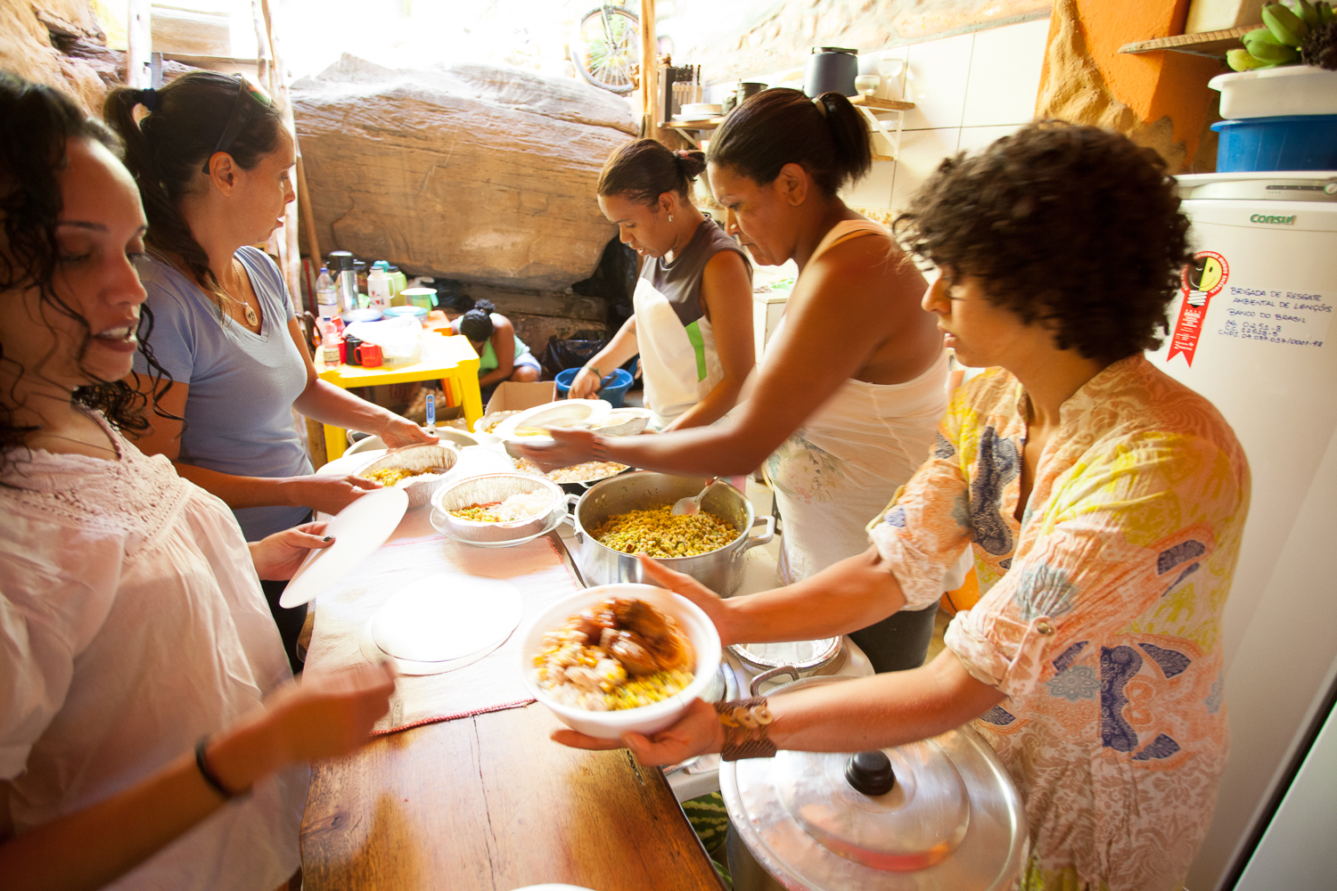 Volunteers work in Ferrera’s kitchen preparing meals for the brigadistas. Photo by Aćony Santos