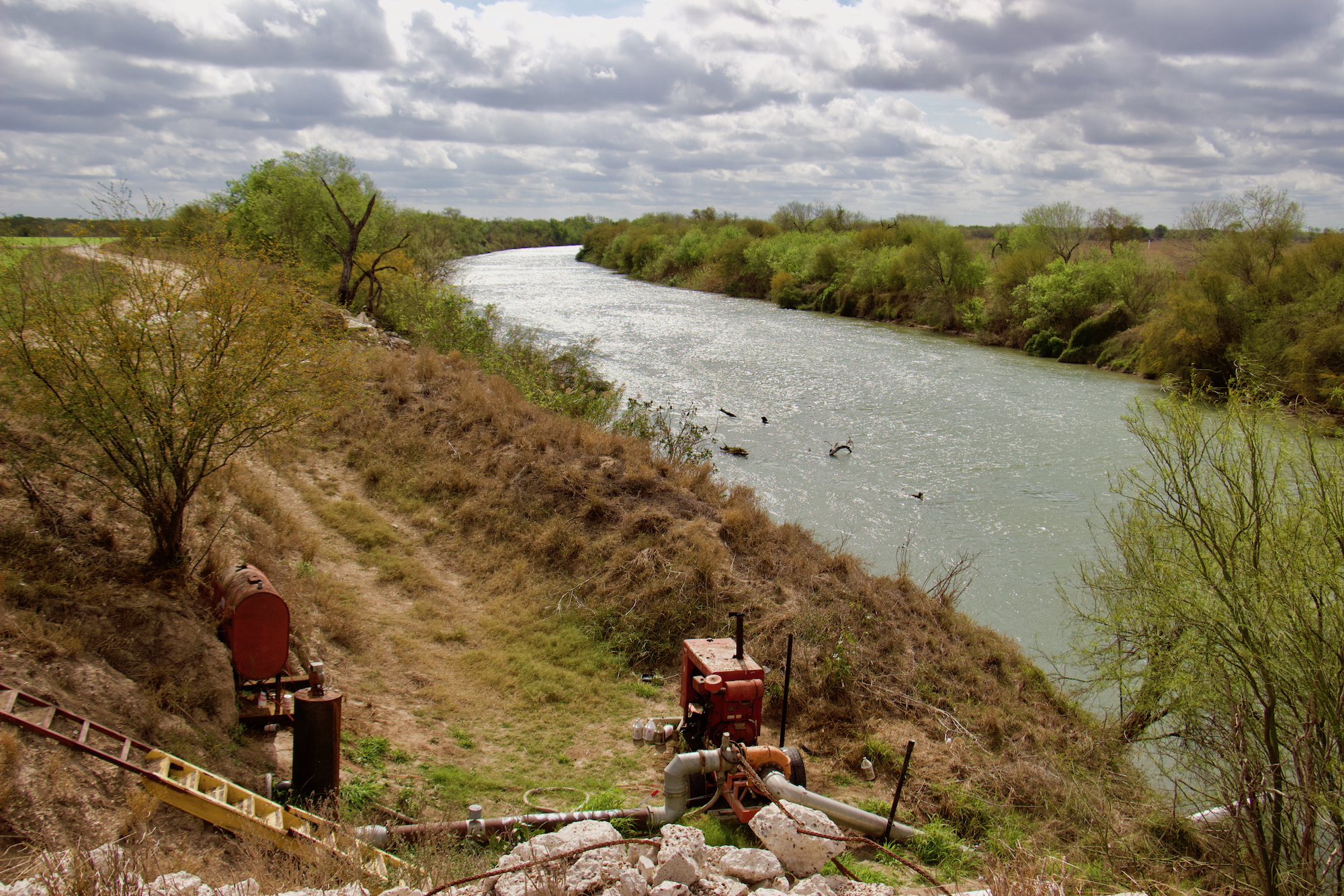 An old irrigation pump sits idle beside the winding Rio Grande less than a mile from Yahui Village.