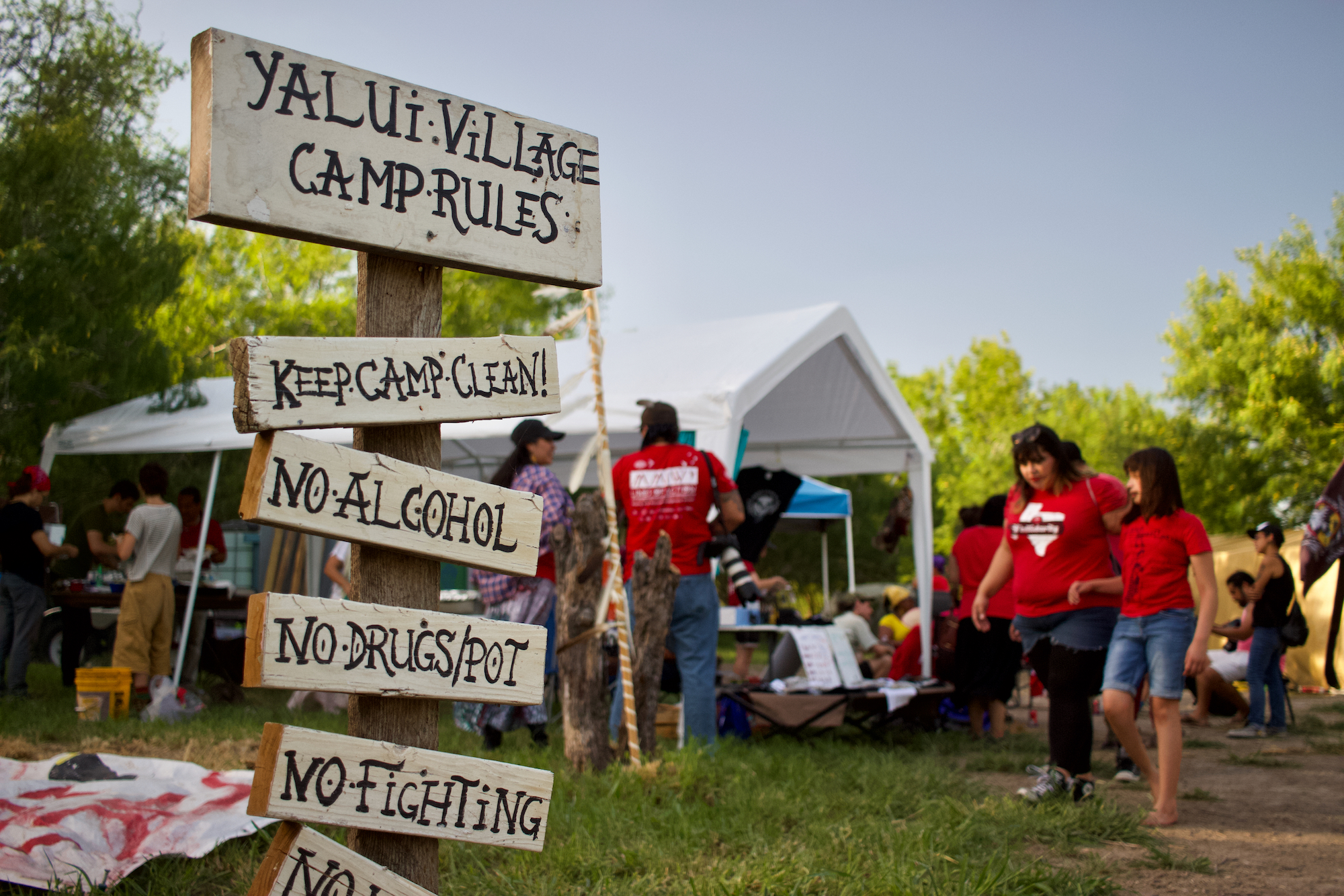 Camp rules at Yalui Village, where roughly 50 tribal members and allies gathered last summer for ceremony and to welcome guests from Alaska's Gwichʼin commumity touring a documentary of their own resistance to federal energy projects. 