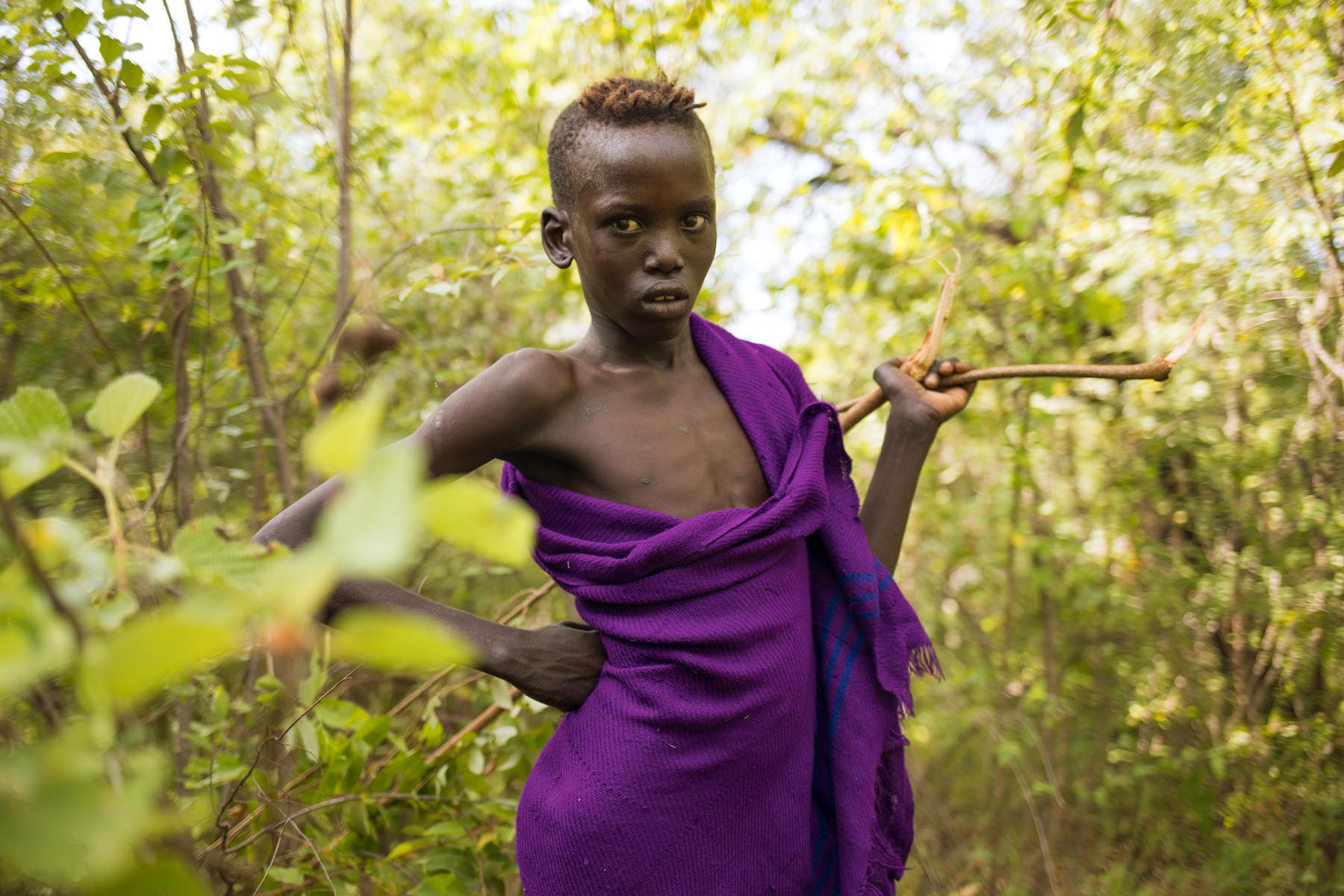 1585227479634-Mursi-boy-herding-cattle-Roc-Morin