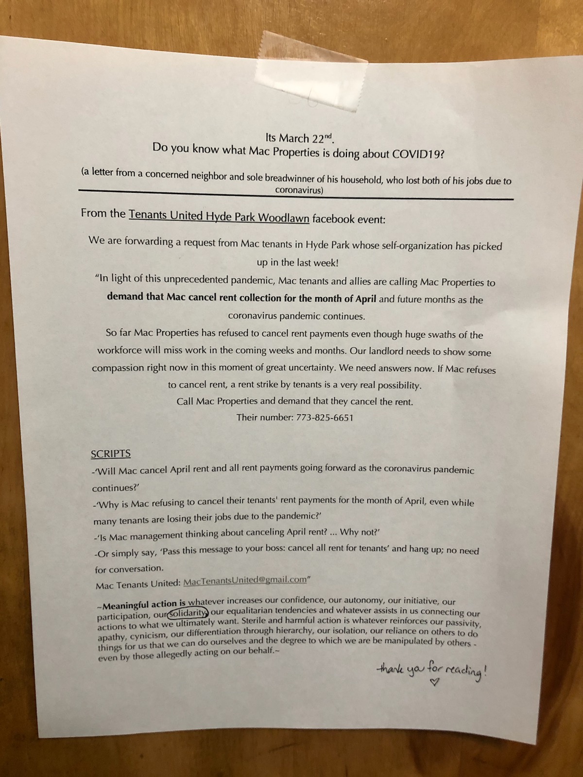 A piece of paper stuck to a door outlining why tenants are withholding rent.