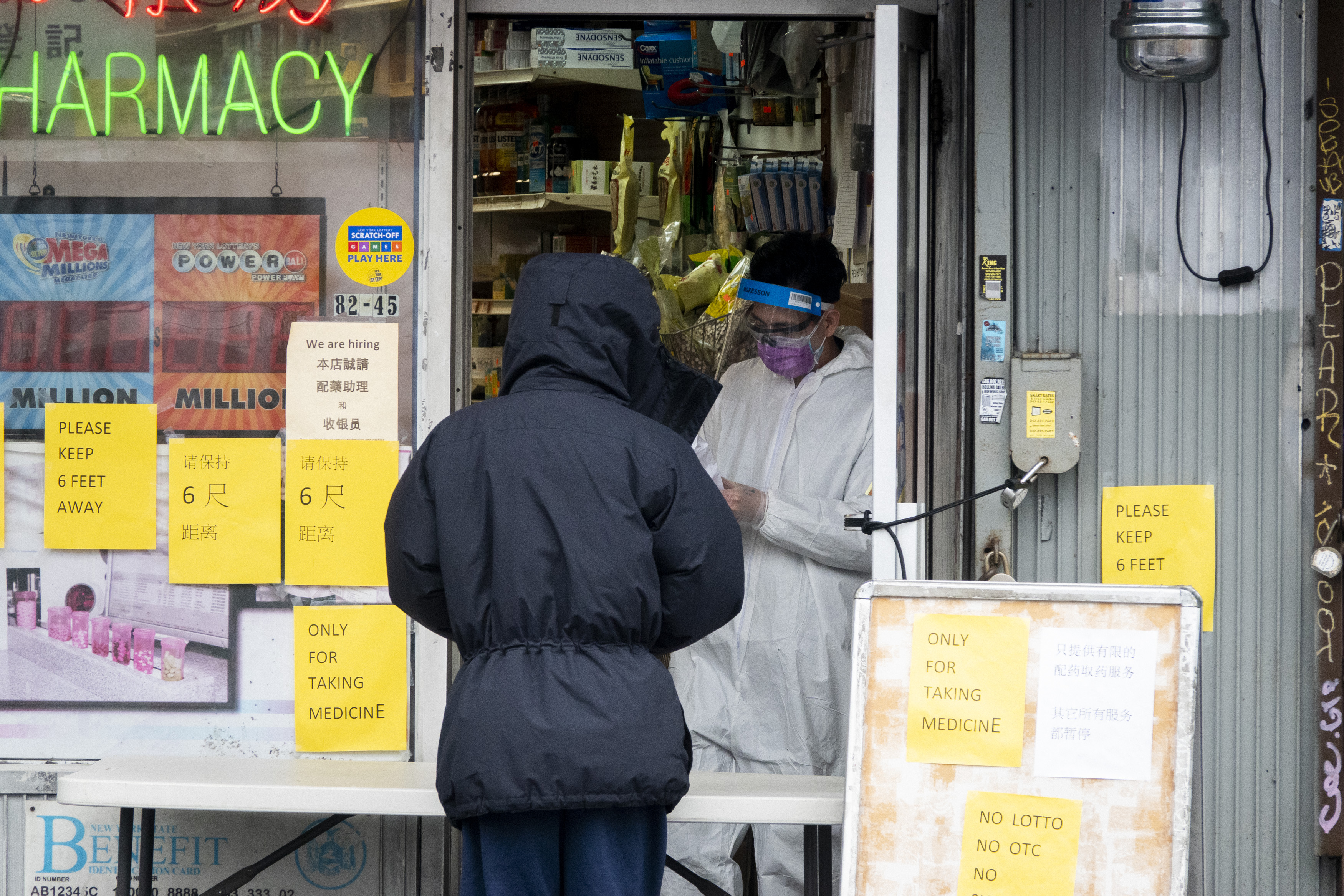 A pharmacist dispenses medicine on Broadway in Queens. April 03, 2020