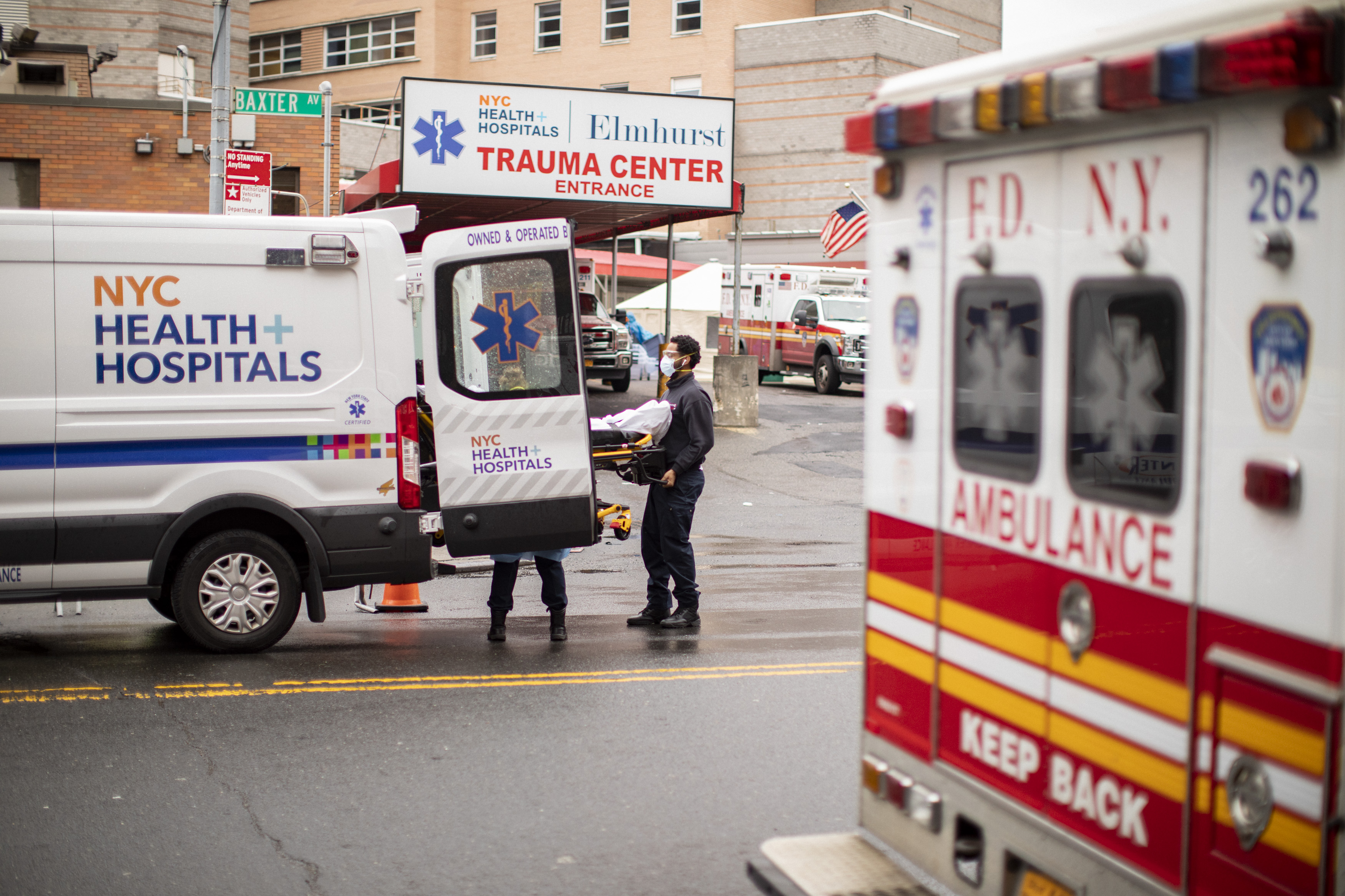 A steady flow of Ambulances outside the Emergency room in Elmhurst Queens. April 03, 2020