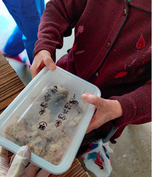 Person receiving a box of food