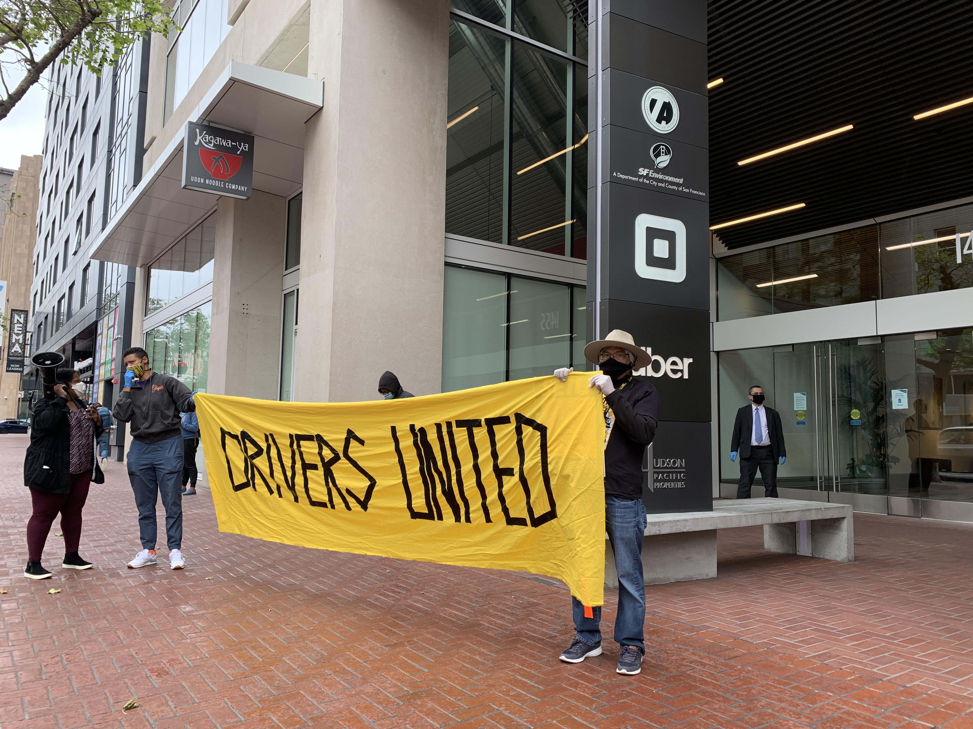 Drivers outside of Uber's San Francisco headquarters