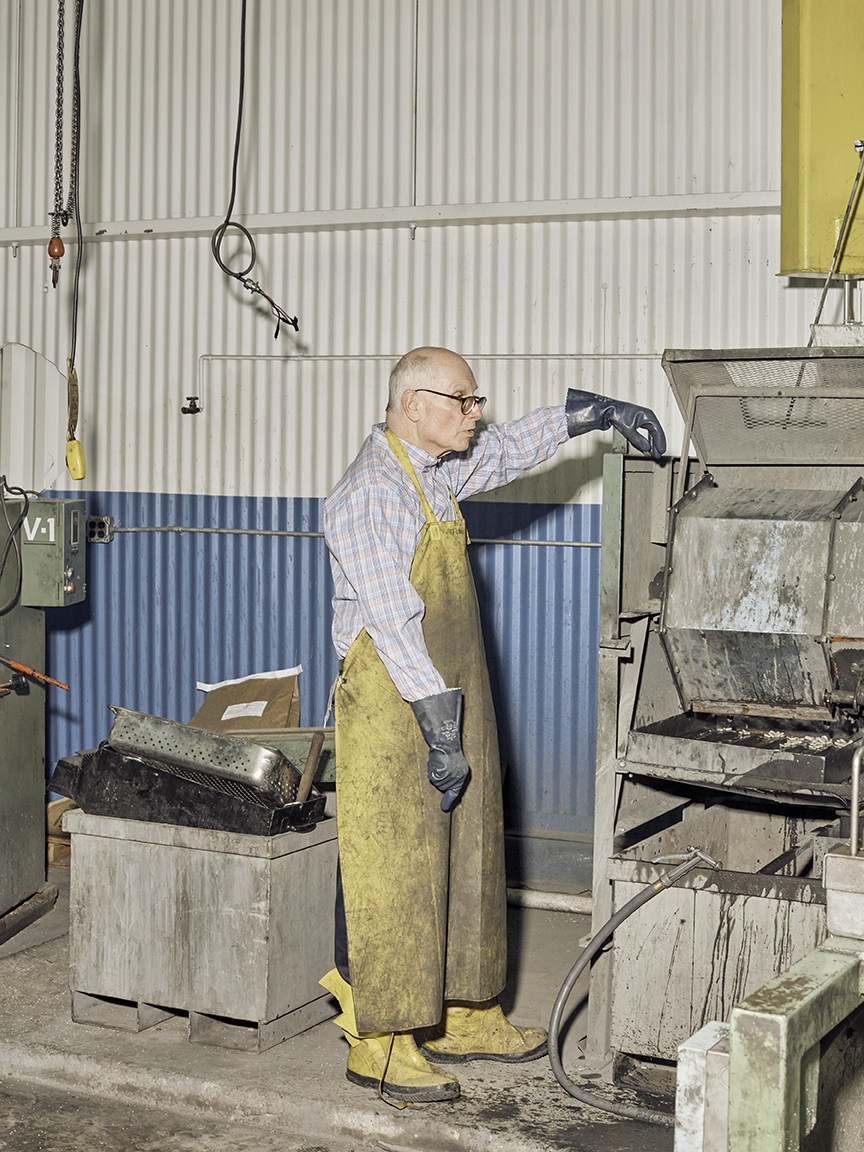 man in yellow outfit working