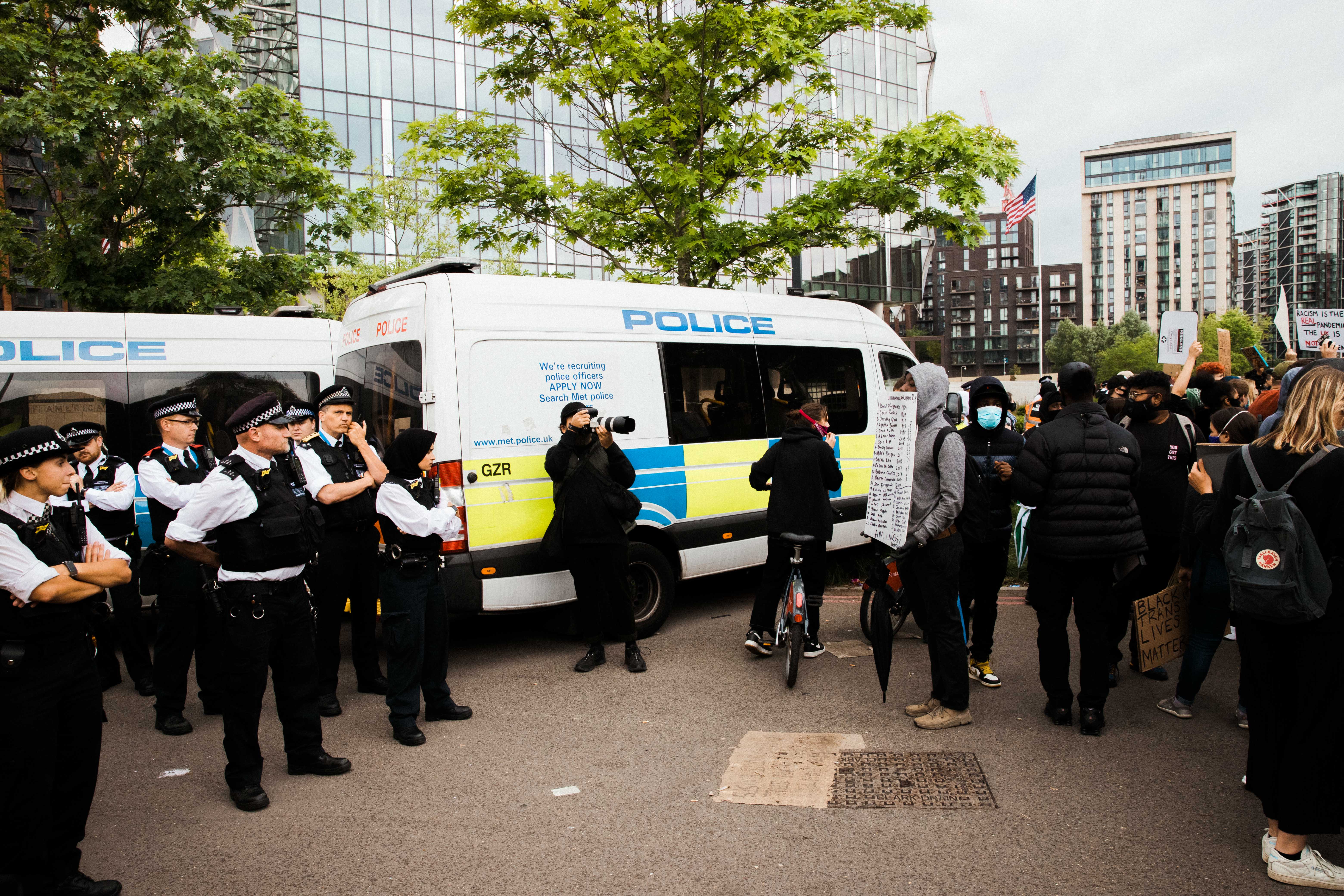 Police looking at protesters during George Floyd demonstration in London, UK