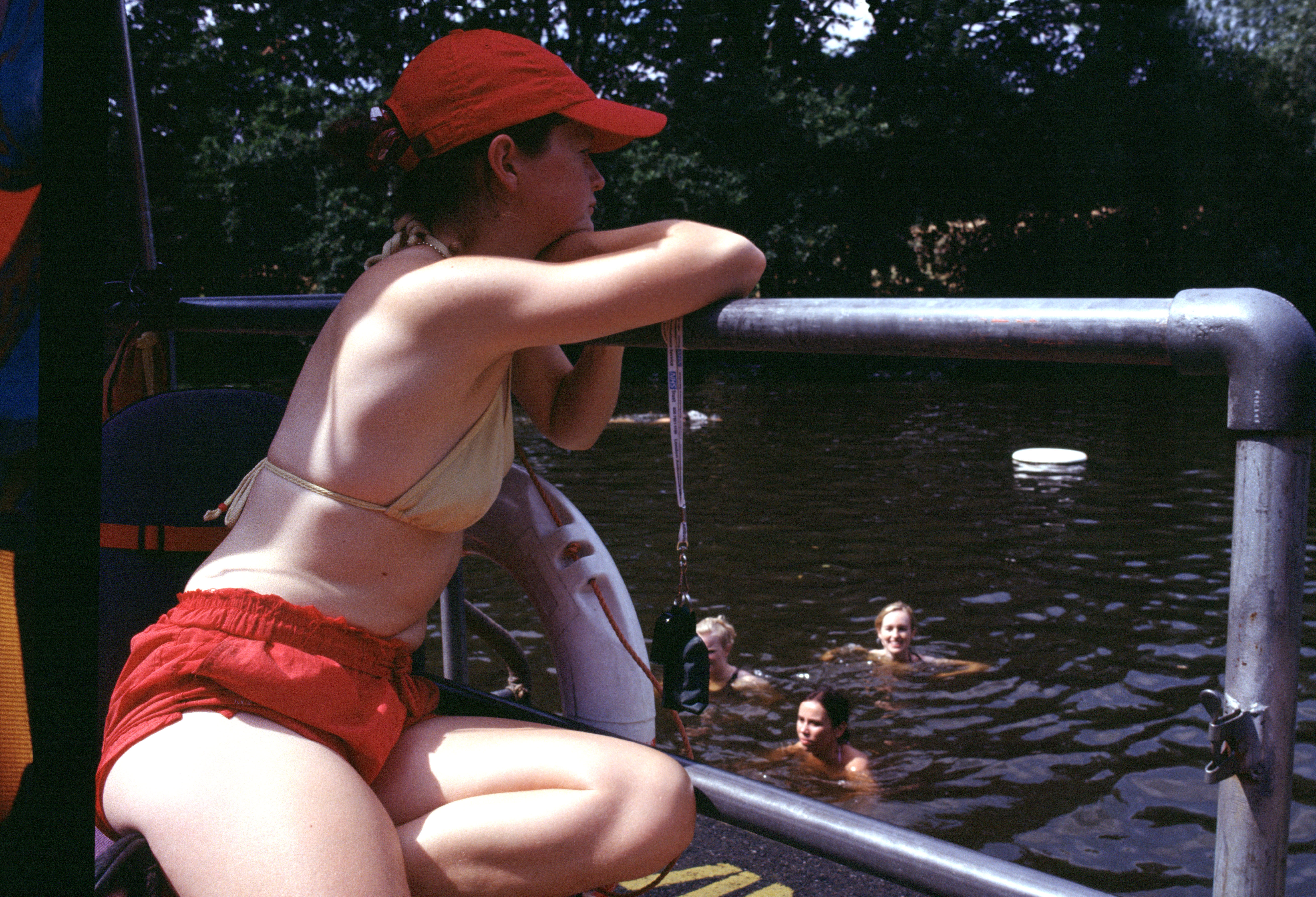 Female lifeguard on duty at Hampstead Heath Ladies Pond