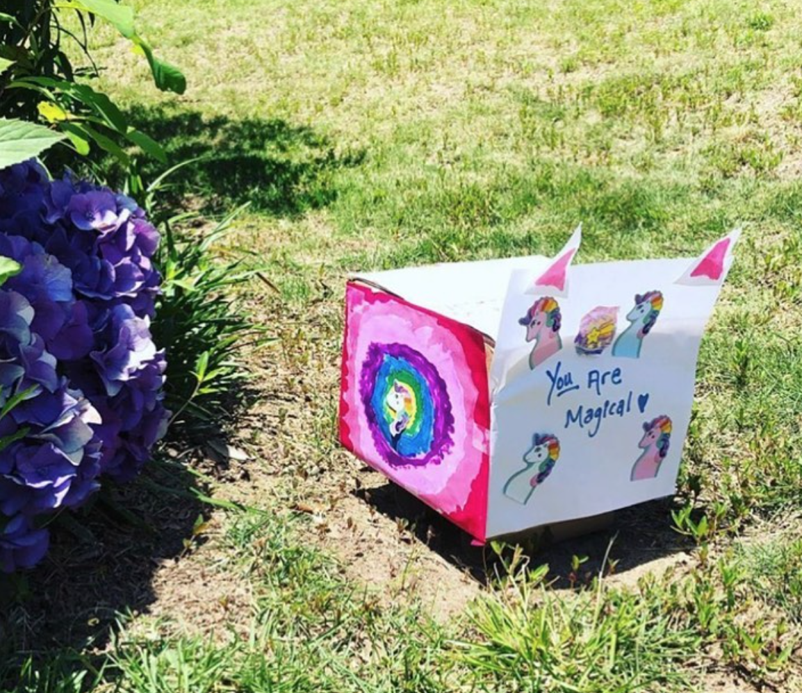 miniature pride float made by children decorated with unicorns with the text 